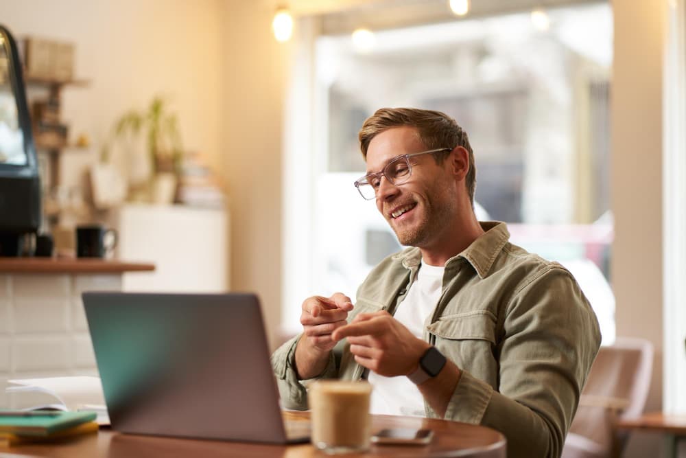 Business owner reviewing returning customer growth on a tablet